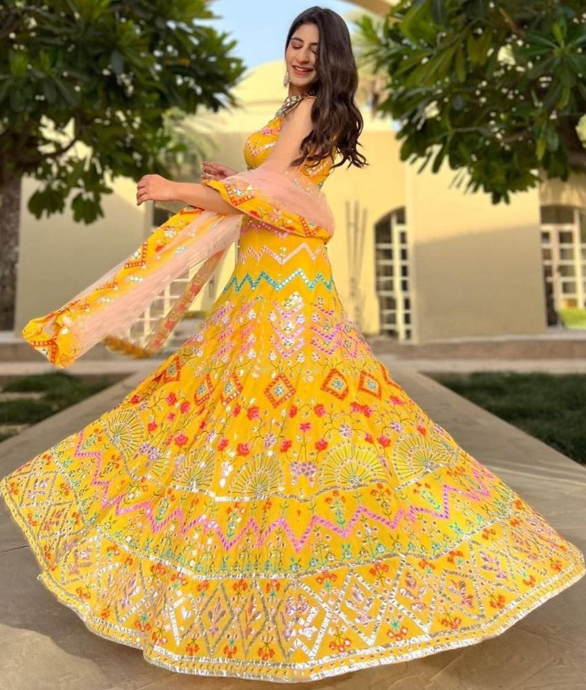 Yellow georgette heavy multi thread embroidered ceremonial lehenga choli
