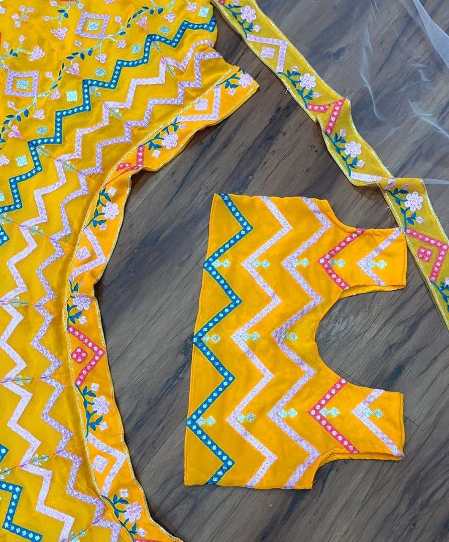 Yellow georgette heavy multi thread embroidered ceremonial lehenga choli