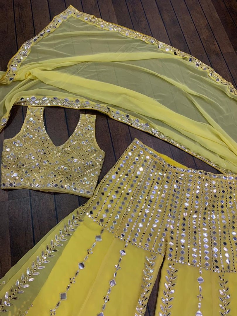Yellow georgette paper mirror work sharara suit