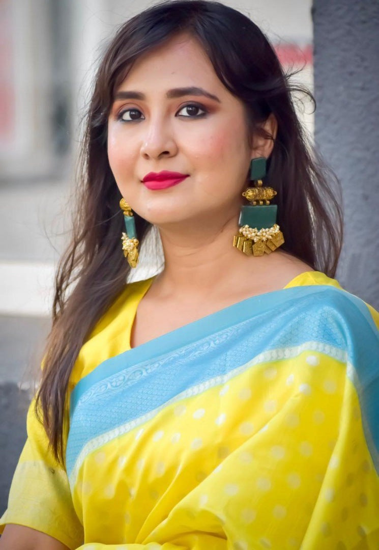Yellow lichi silk jacquard weaving work saree