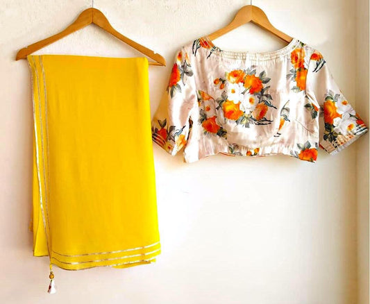 Yellow moss georgette plain saree with floral printed blouse