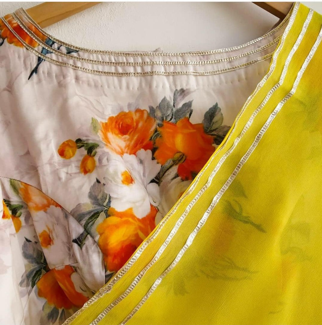 Yellow moss georgette plain saree with floral printed blouse