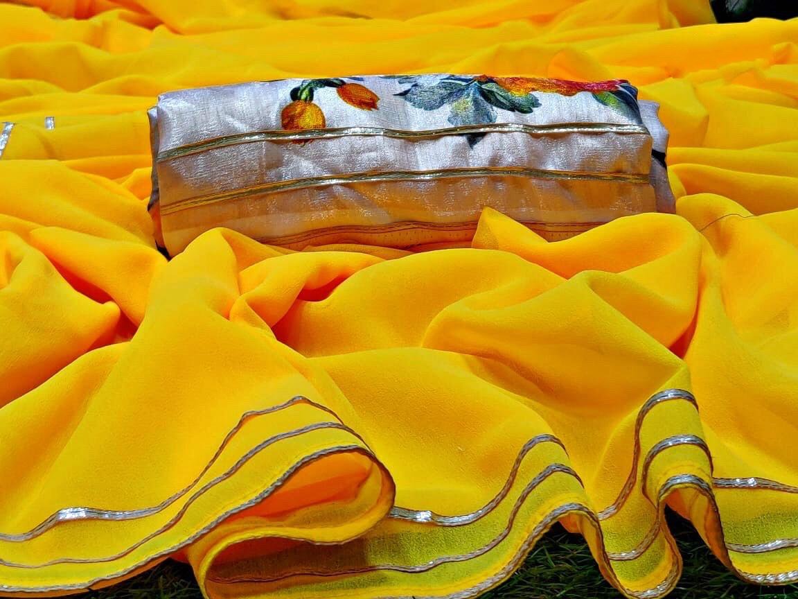 Yellow moss georgette plain saree with floral printed blouse