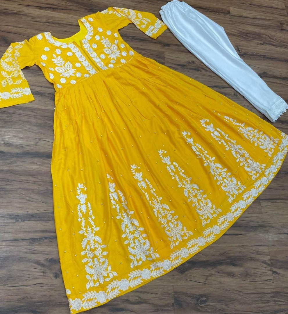 Yellow muslin cotton embroidered with moti work plazzo suit