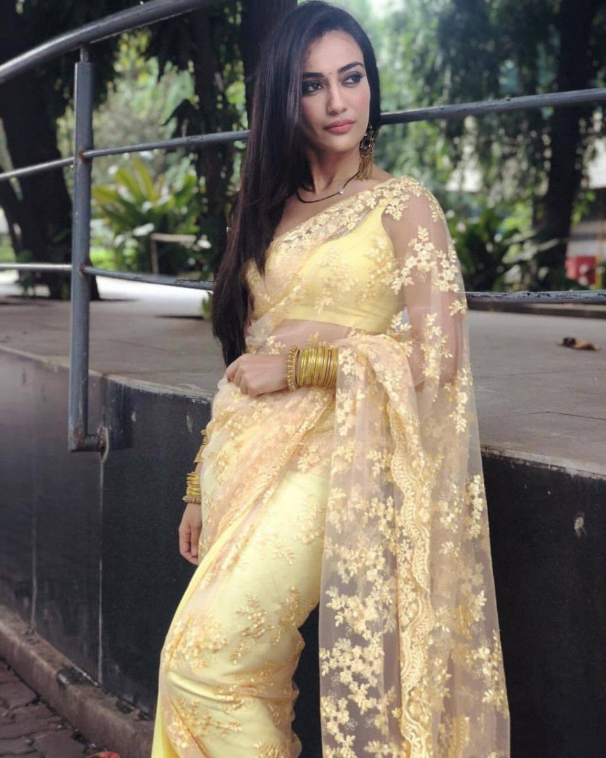 yellow net beautiful heavy embroidered surbhi jyoti saree