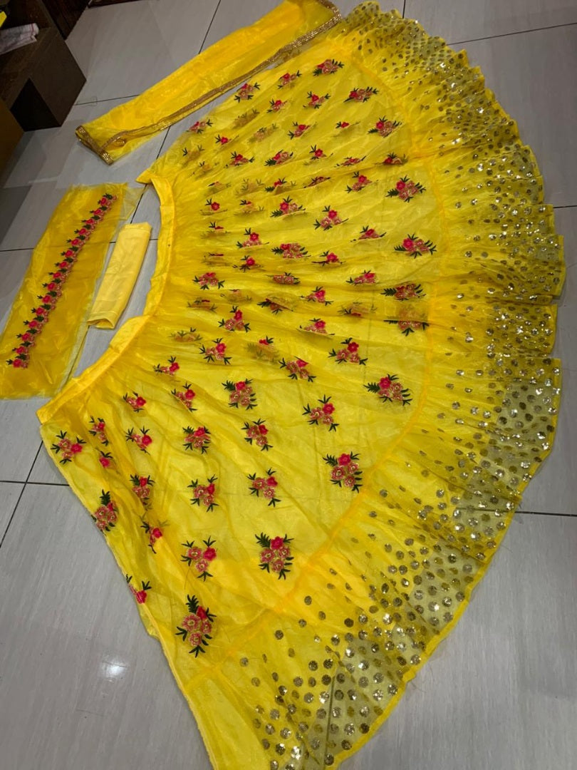 Yellow net embroidered lehenga choli