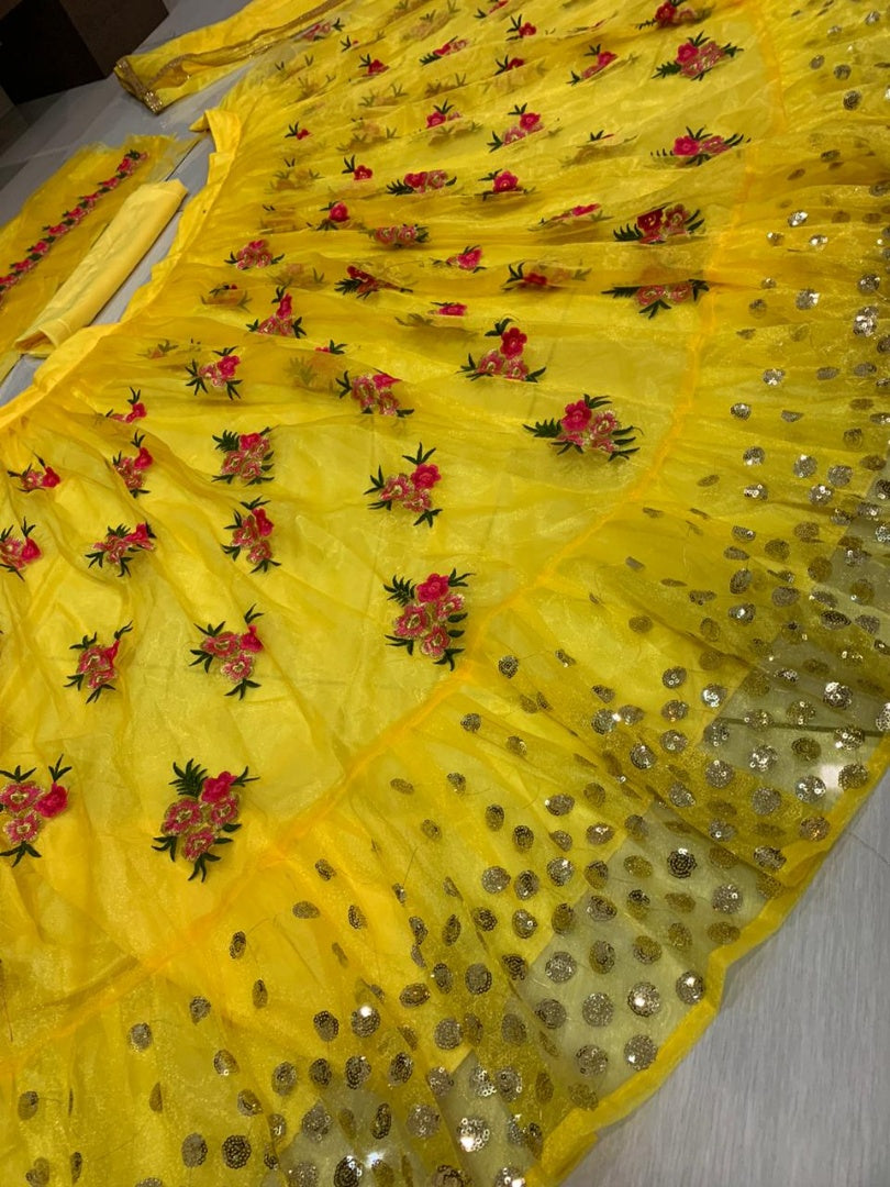 Yellow net embroidered lehenga choli