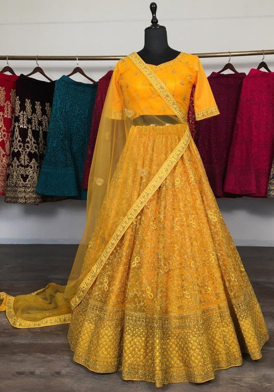 Yellow net glitter zari embroidery work lehenga choli