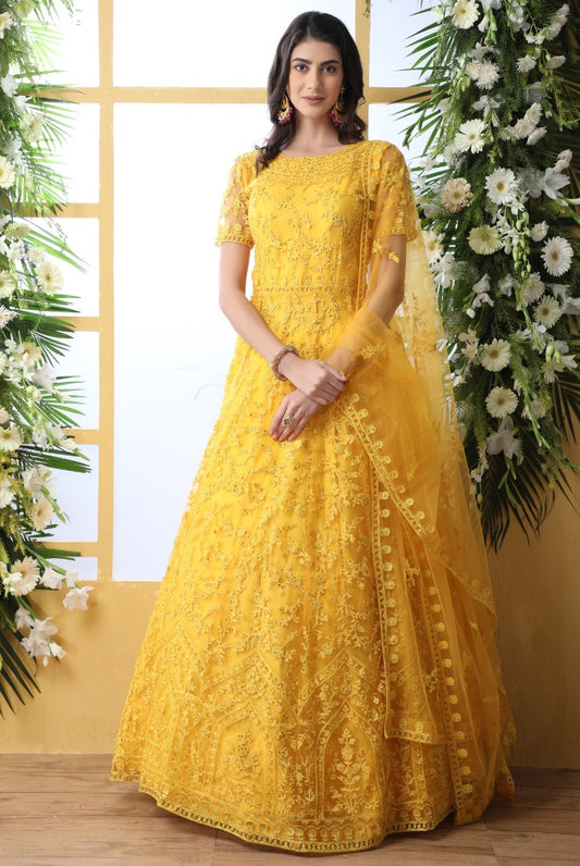 Yellow net heavy embroidered wedding long anarkali gown