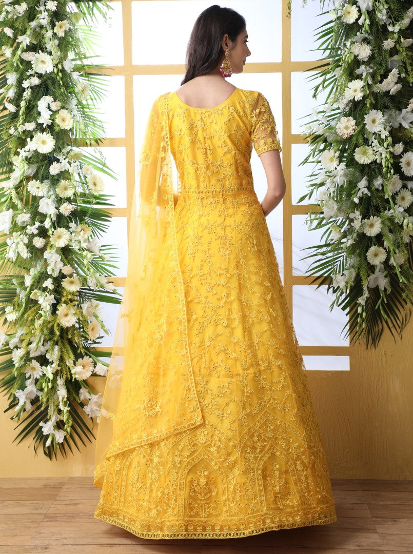 Yellow net heavy embroidered wedding long anarkali gown