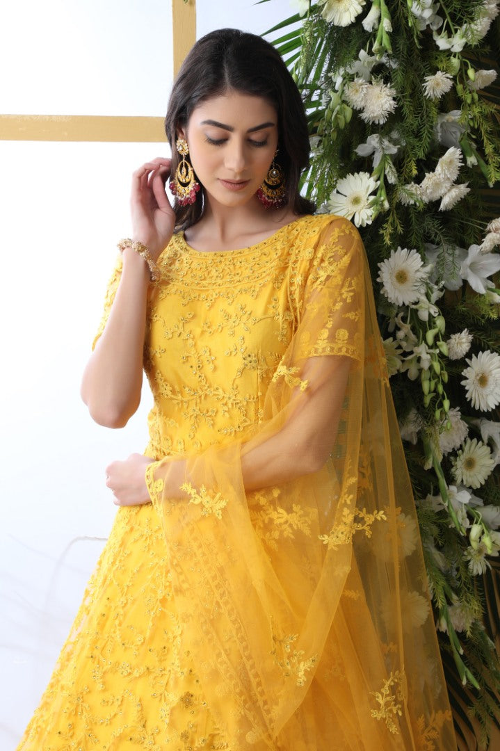 Yellow net heavy embroidered wedding long anarkali gown