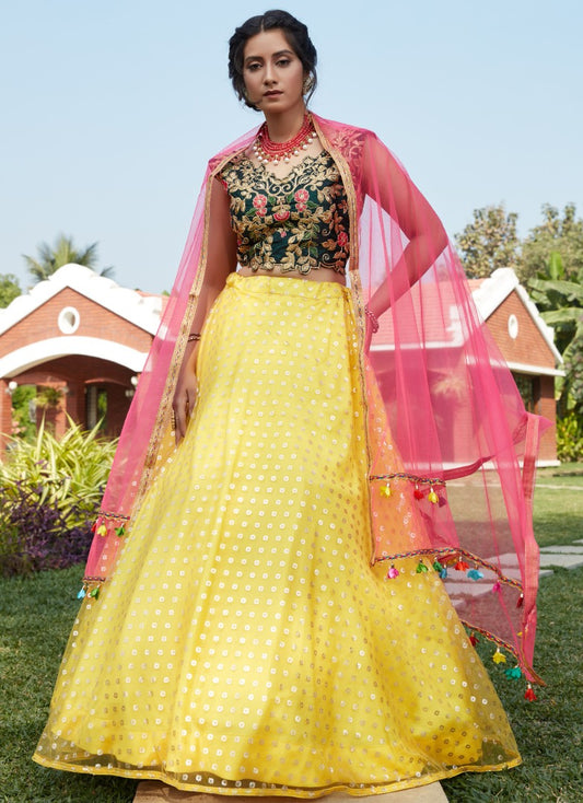 Yellow net metallic foil printed work party wear lehenga choli