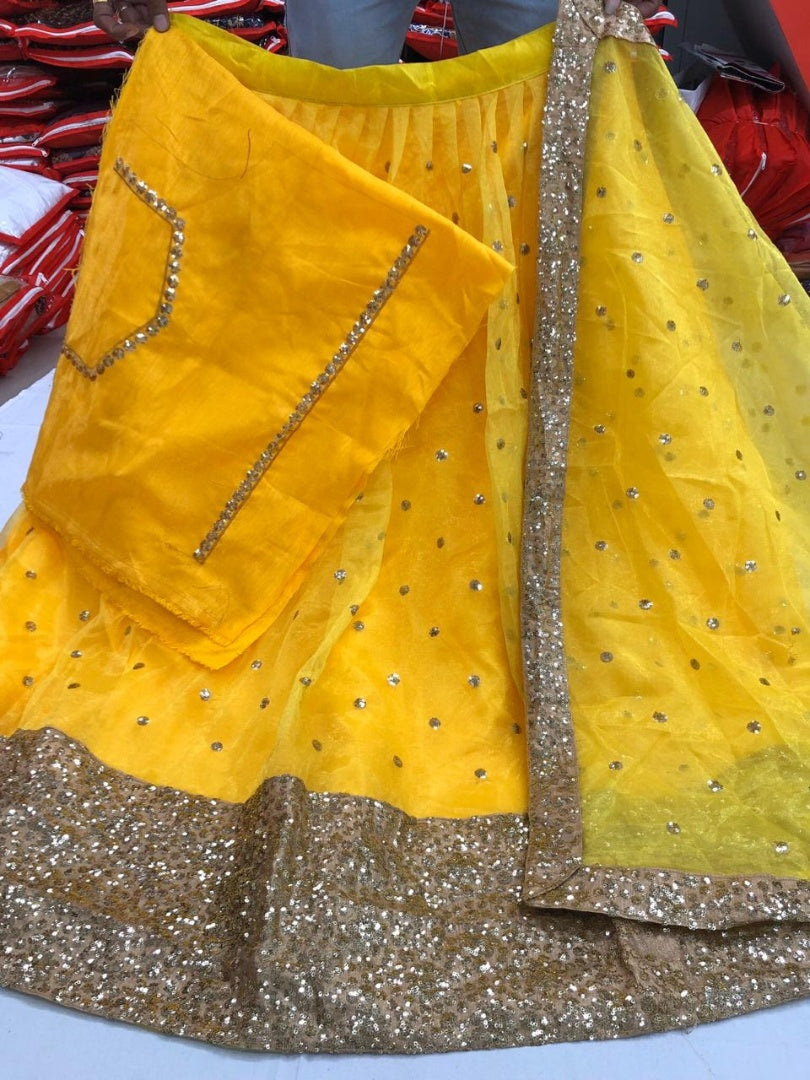 Yellow net sequence work ceremonial lehenga choli