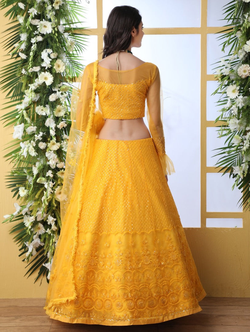 Yellow net thread and sequence embroidered wedding lehenga choli