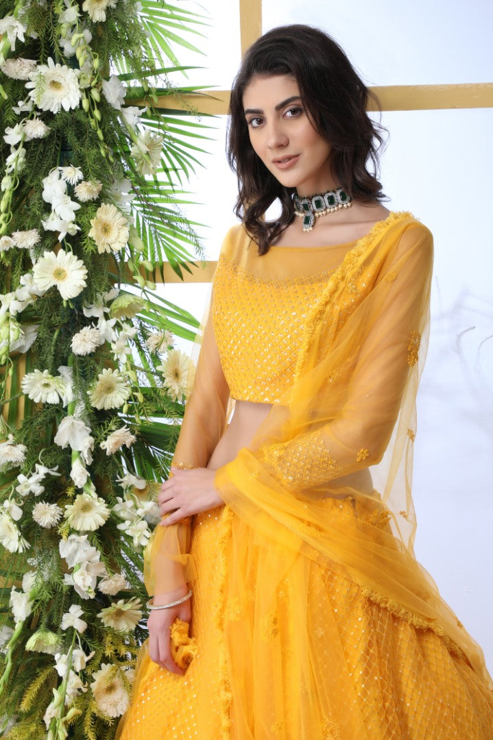 Yellow net thread and sequence embroidered wedding lehenga choli