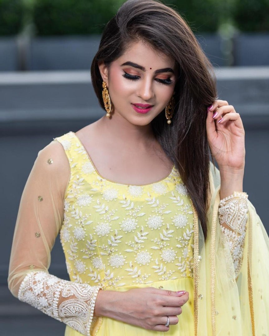 Yellow net thread embroidered anarkali suit