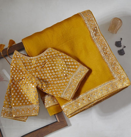 Yellow organza coading and sequence work wedding saree