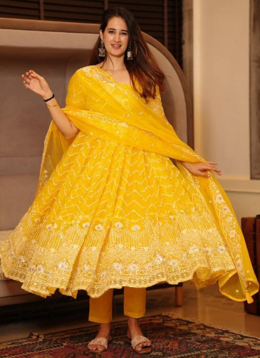 Yellow organza emboroidered anarkali suit for ceremony