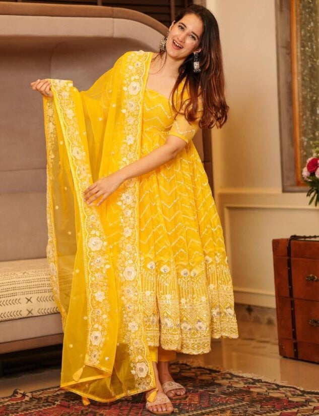 Yellow organza emboroidered anarkali suit for ceremony