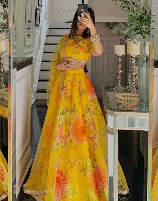 Yellow organza floral printed lehenga choli for haldi ceremony