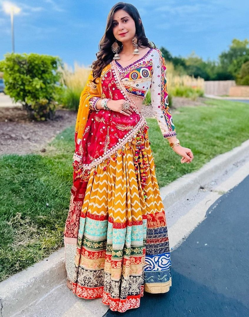 Yellow print mirror work kinjal dave gujarati garba navratri chaniya choli