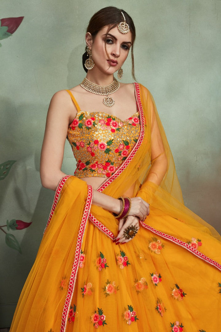 Yellow soft net sequence and theadworked lehenga choli for haldi