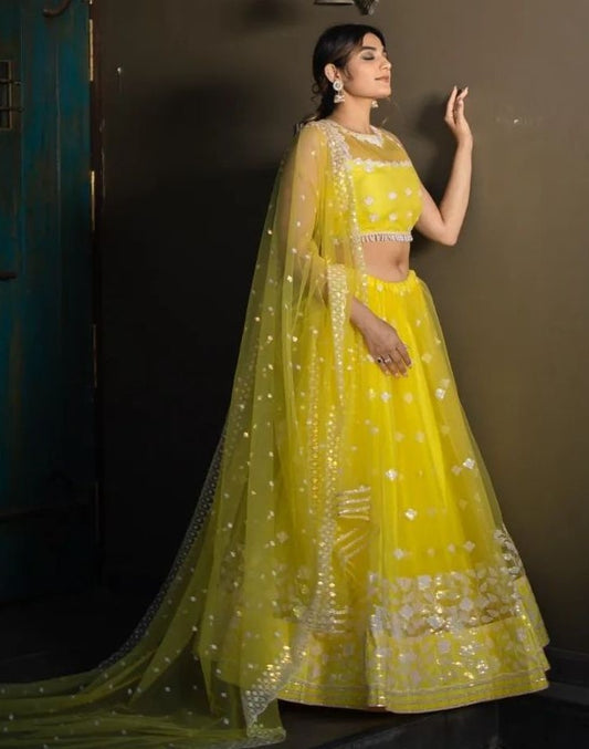 Yellow soft net sequence and thread embroidery work lehenga choli for ceremony