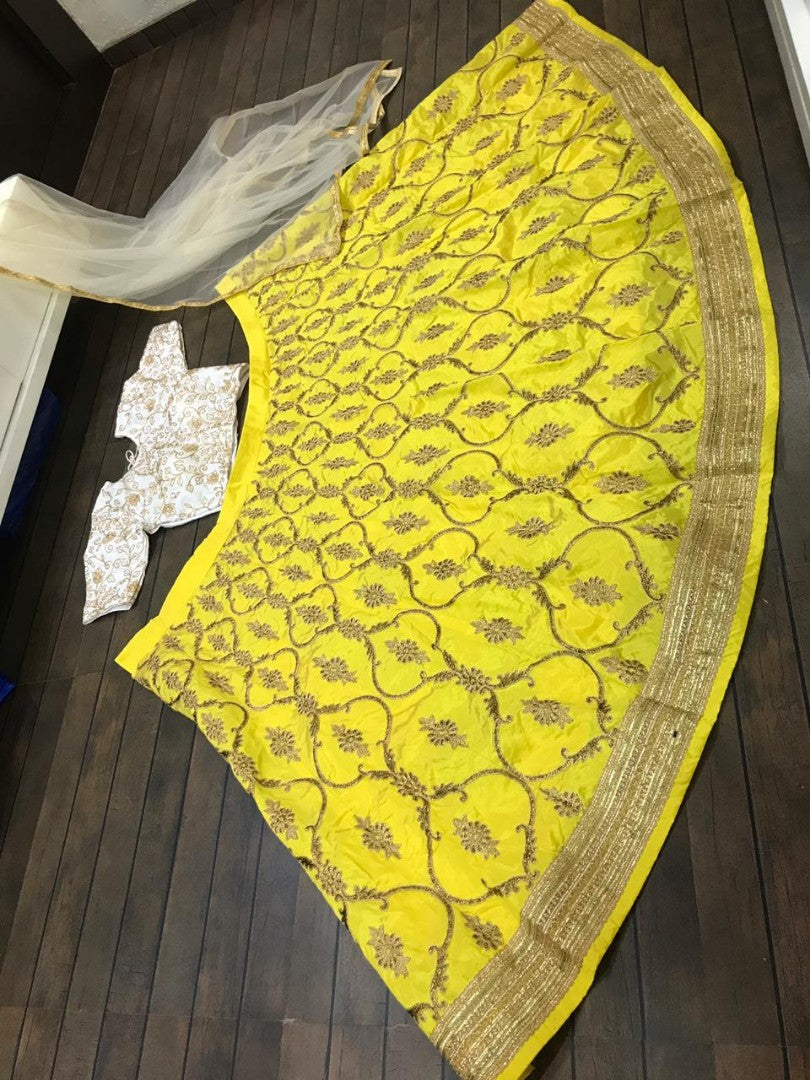 yellow tapeta silk embroidered wedding lehenga choli