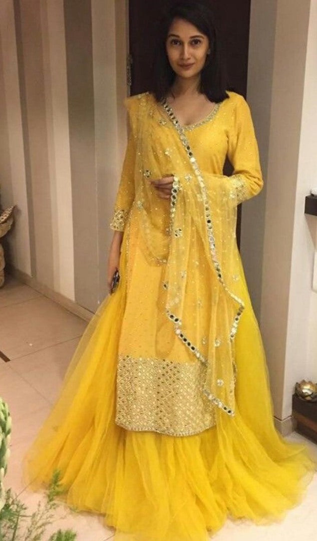 Yellow tapeta silk with foil mirror work suit lehenga