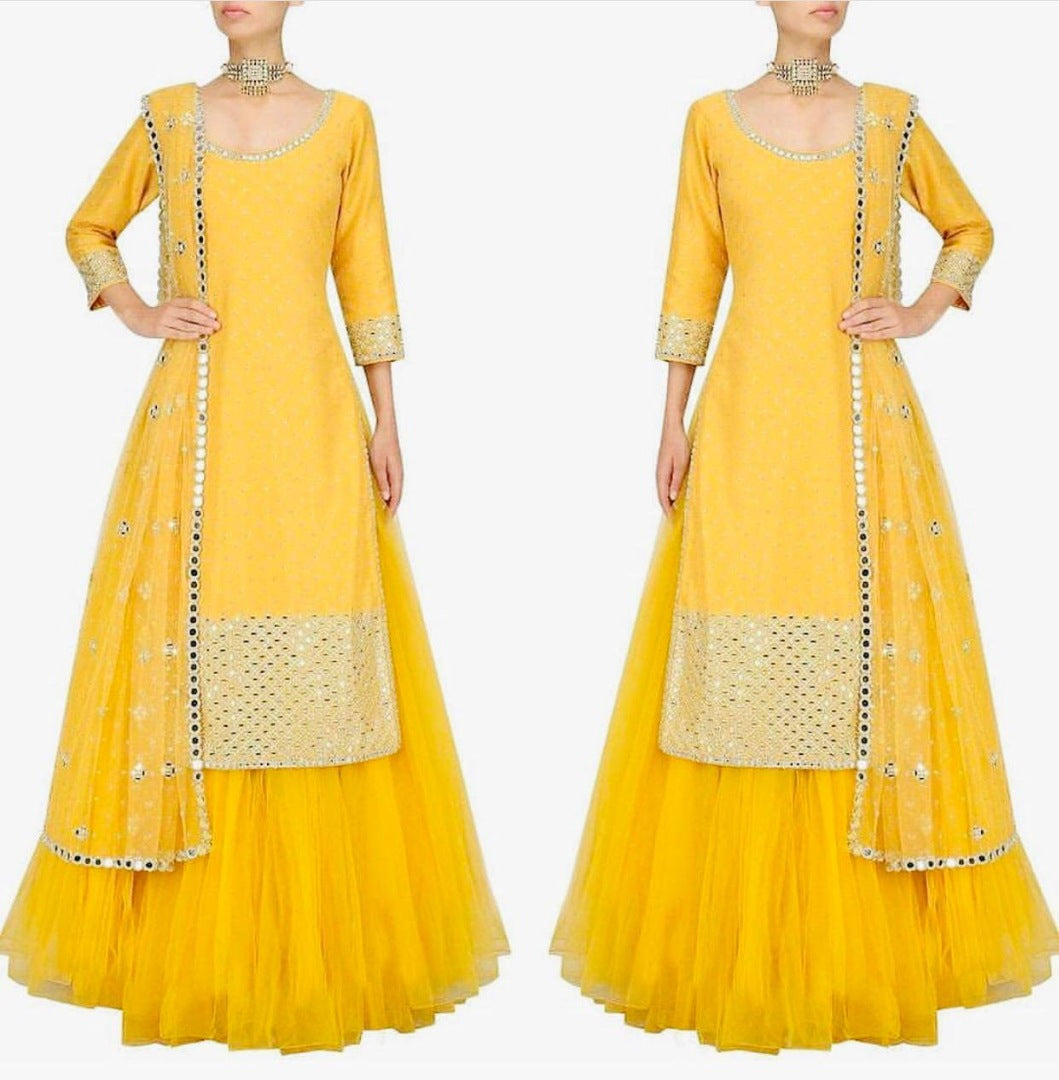 Yellow tapeta silk with foil mirror work suit lehenga