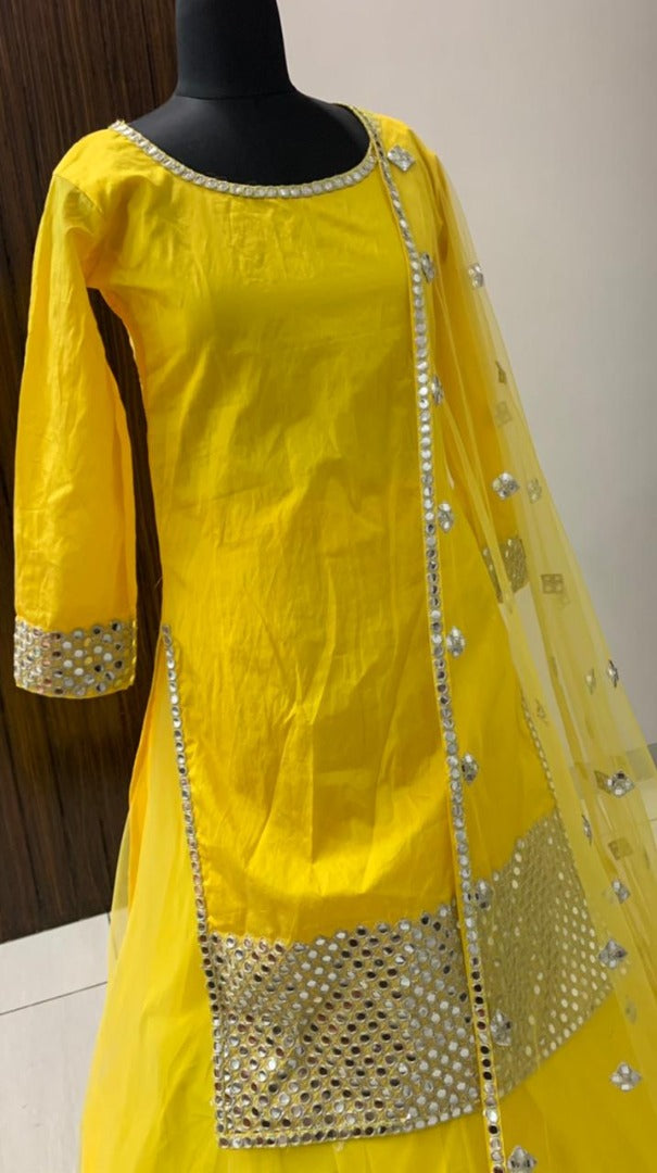 Yellow tapeta silk with foil mirror work suit lehenga