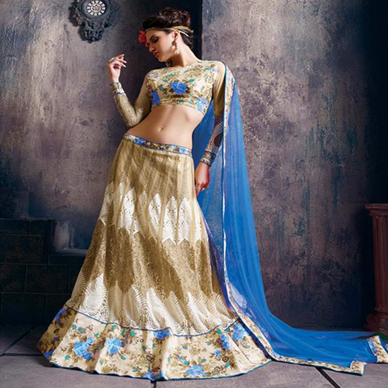 A traditional lehenga choli ensemble in red and gold, featuring intricate embroidery and vibrant patterns. The long, flared lehenga and fitted choli are paired with a matching dupatta draped over one shoulder