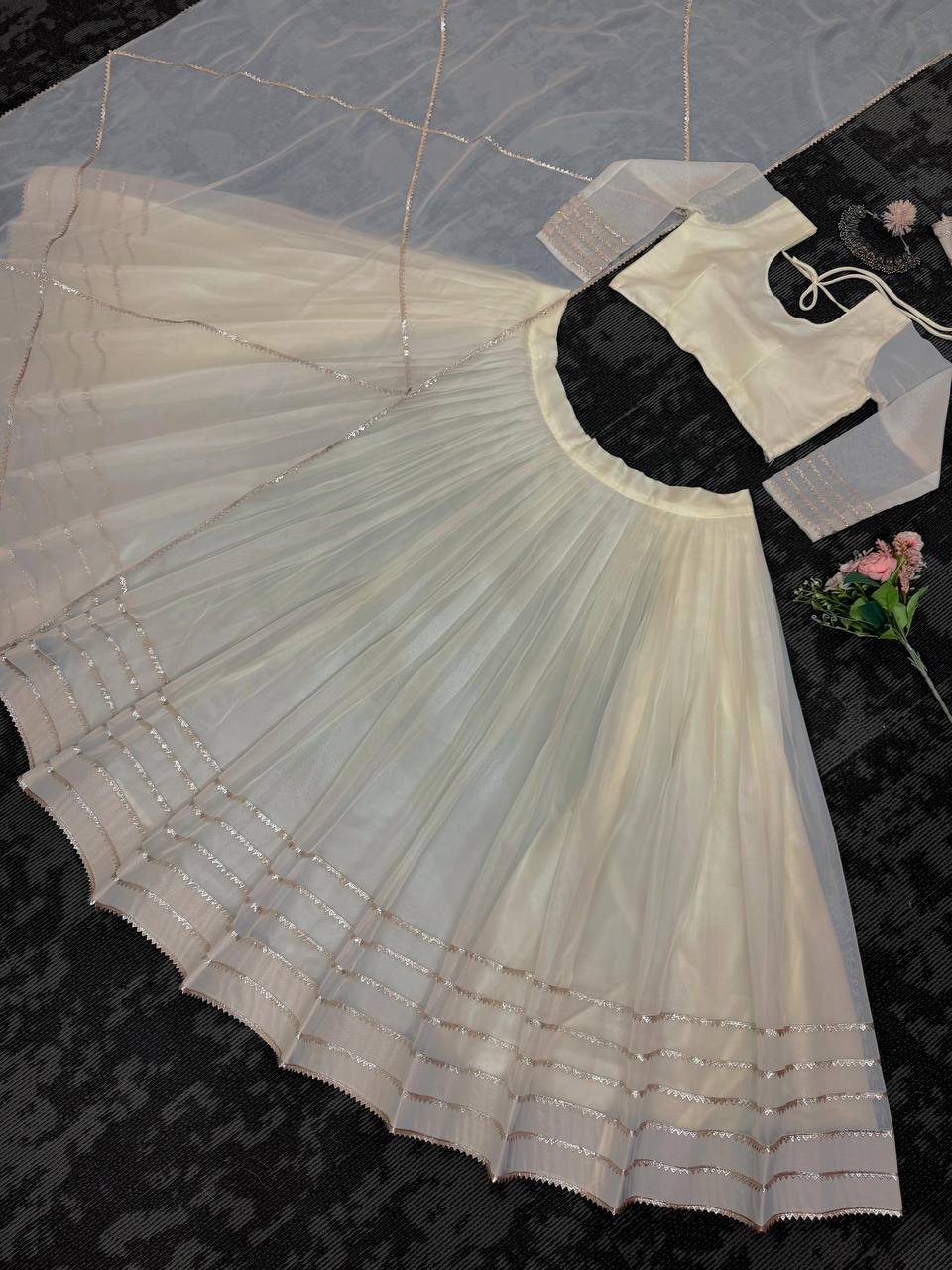 Off White Organza Print and Lace Border Ceremonial Lehenga Choli