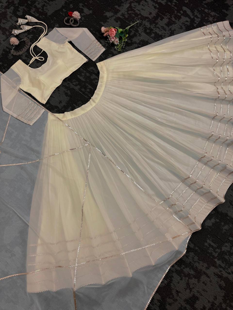Off White Organza Print and Lace Border Ceremonial Lehenga Choli