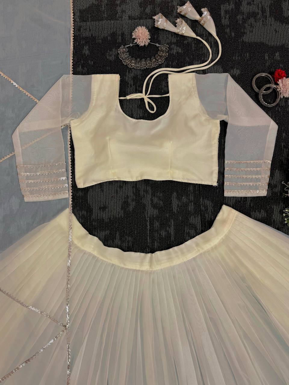 Off White Organza Print and Lace Border Ceremonial Lehenga Choli