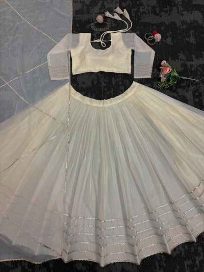 Off White Organza Print and Lace Border Ceremonial Lehenga Choli