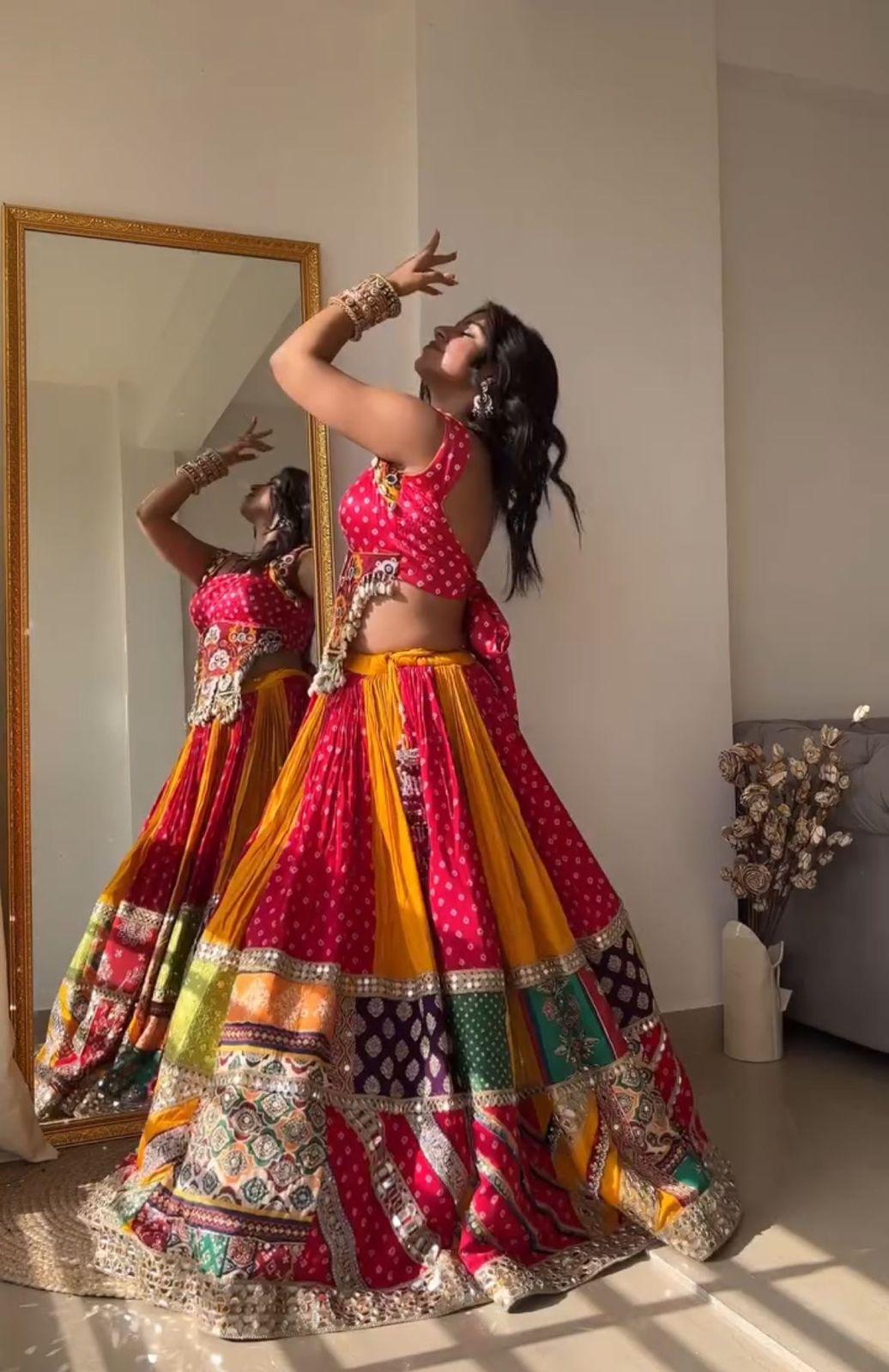 Orange pink print mirror work navratri lehenga chaniya choli
