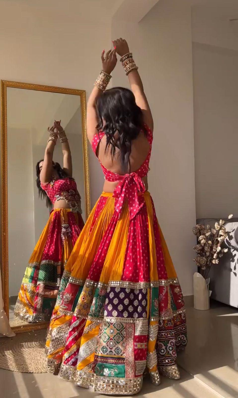 Orange pink print mirror work navratri lehenga chaniya choli