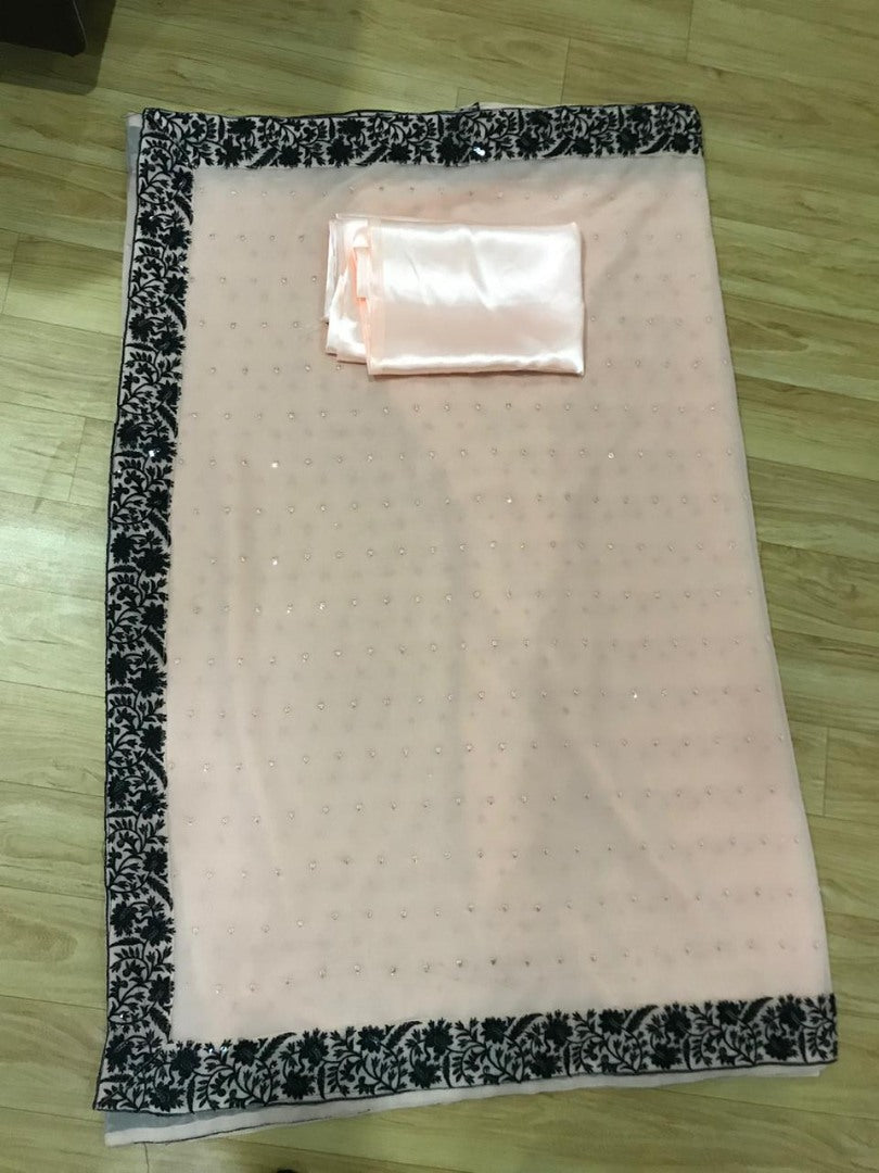 Cream georgette sequence work saree