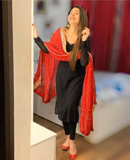 Black georgette salwar suit with red dupatta