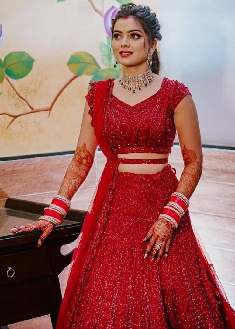 Red heavy embroidered sequence worked wedding lehenga choli
