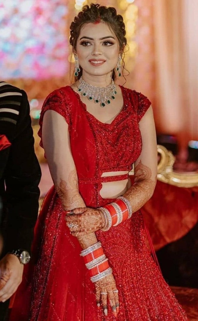 Red heavy embroidered sequence worked wedding lehenga choli