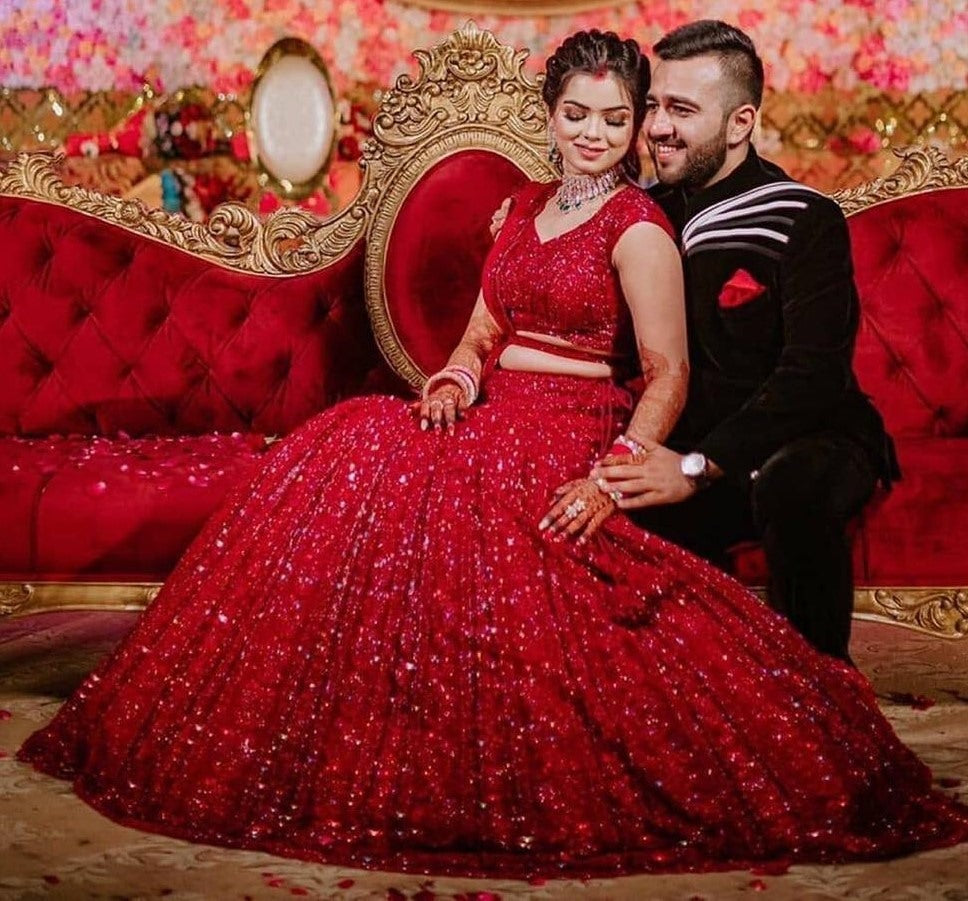 Red heavy embroidered sequence worked wedding lehenga choli