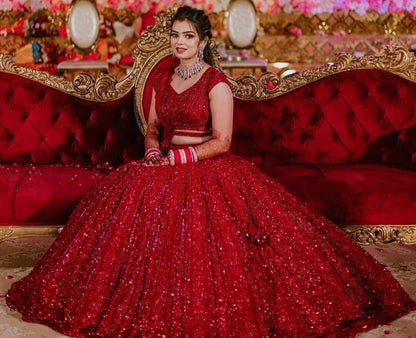 Red heavy embroidered sequence worked wedding lehenga choli