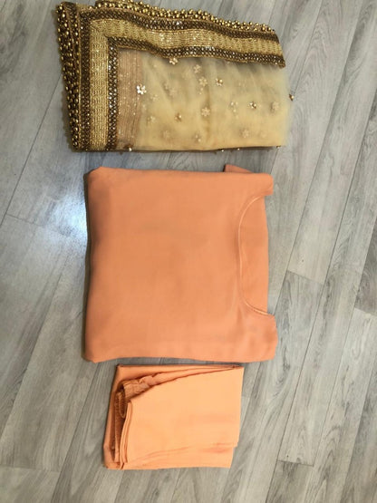 Light orange salwar suit with heavy dupatta