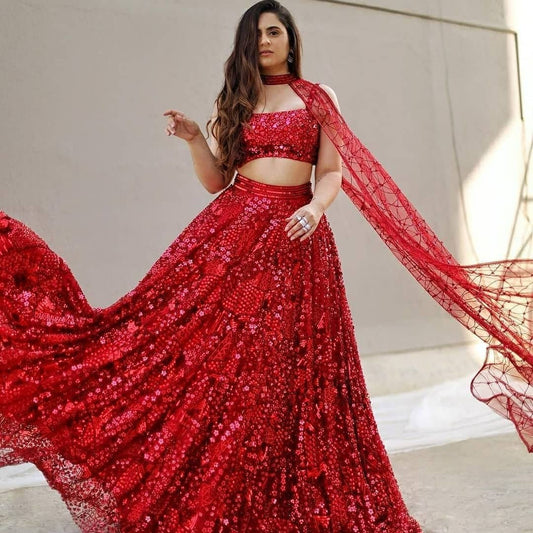 Red soft net heavy sequence work wedding lehenga choli