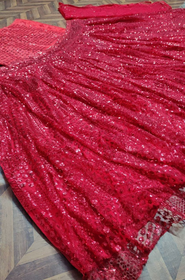 Red soft net heavy sequence work wedding lehenga choli