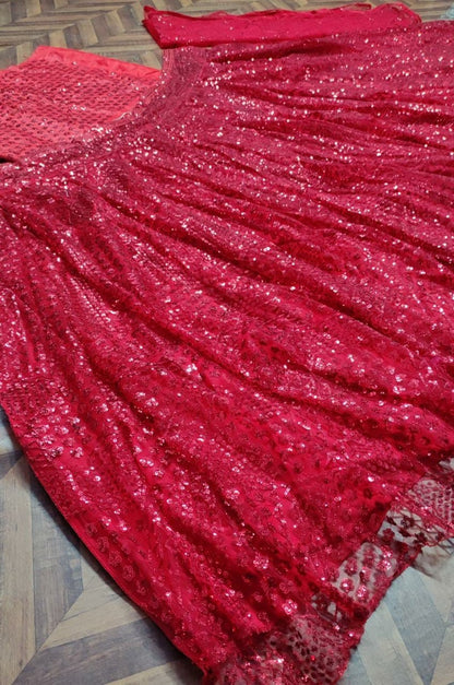 Red soft net heavy sequence work wedding lehenga choli