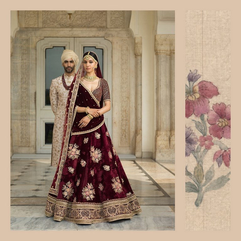 Deep maroon royal wedding lehenga with gold embroidery
