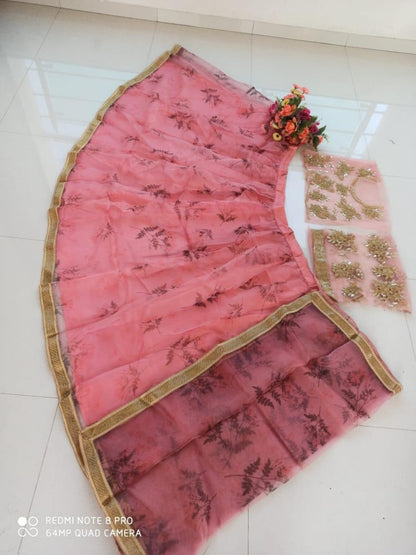 Baby pink organza printed lehenga with heavy work blouse